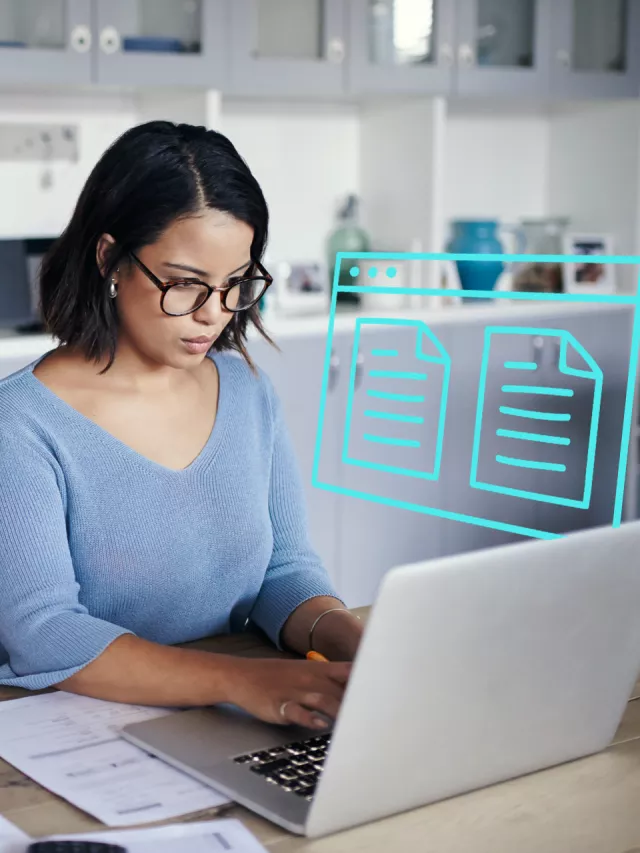 woman managing documents on laptop