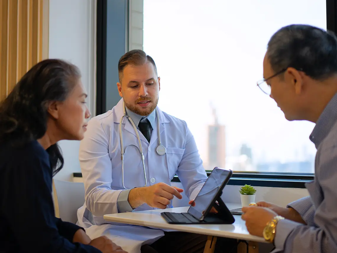 A doctor consulting two patients.