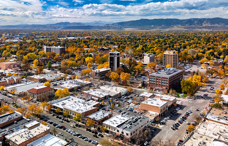 Fort Collins Aerial With Rocky Mountains Backdrop During Autumn