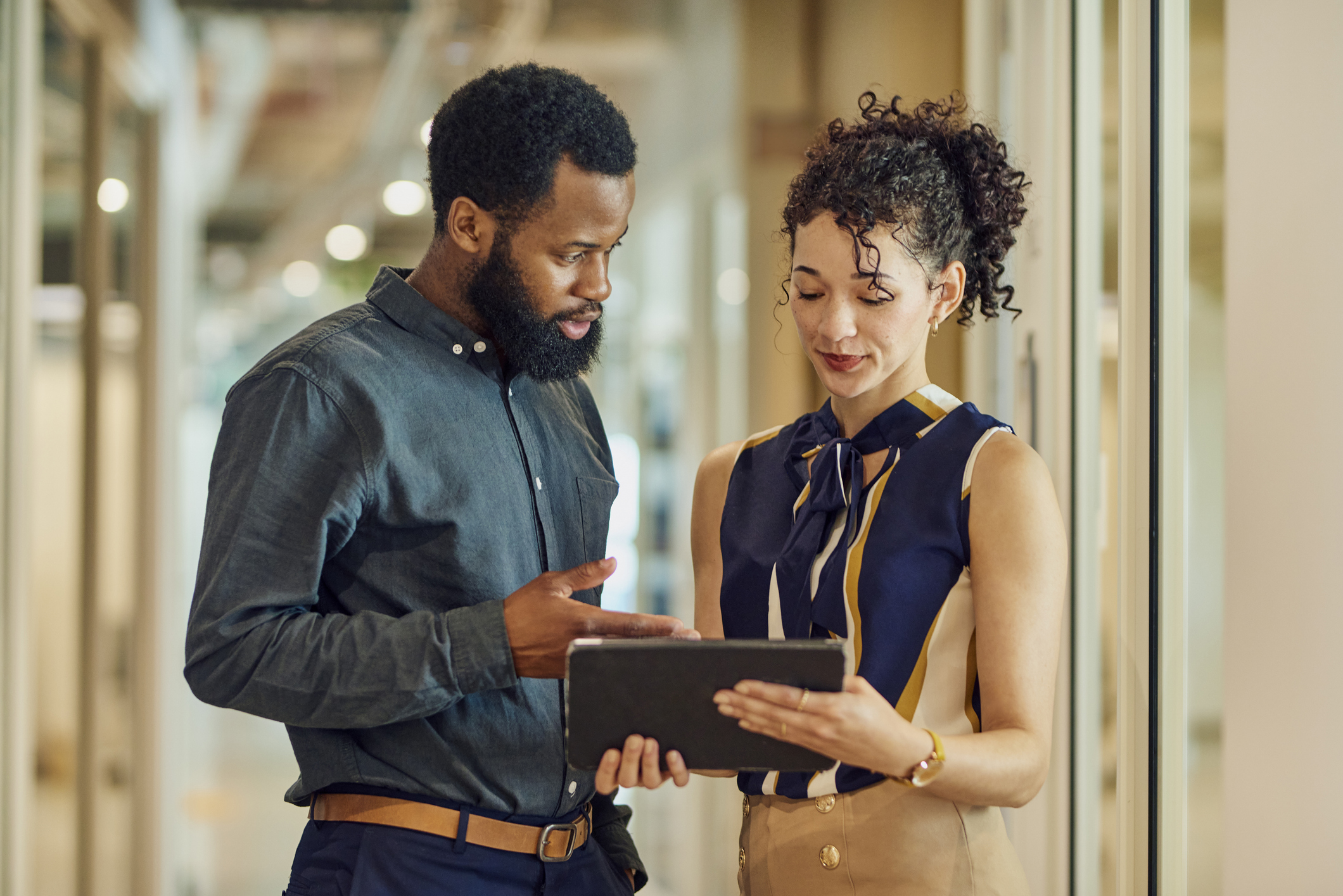 An engaged discussion about a project using a tablet